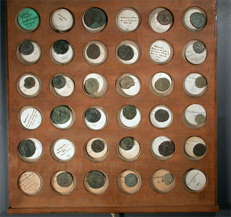 Tray of coins in Manning coin collection cabinet
